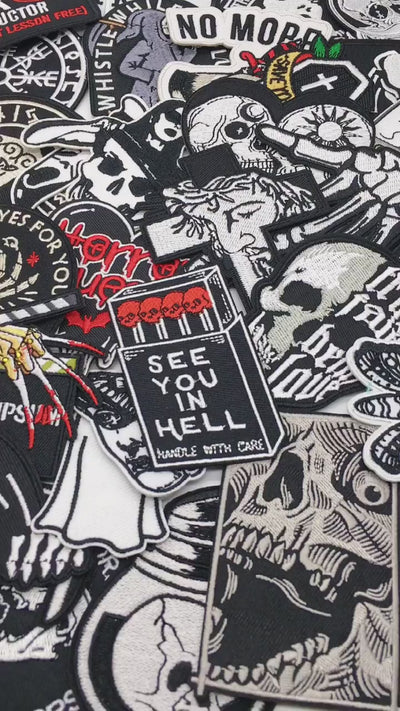 video of a Collection of various patches with different designs on a black background