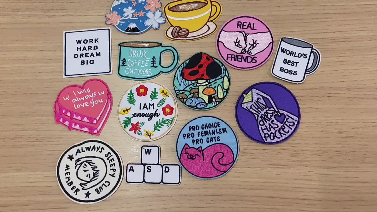 video of a Collection of various colorful patches with different designs and text.