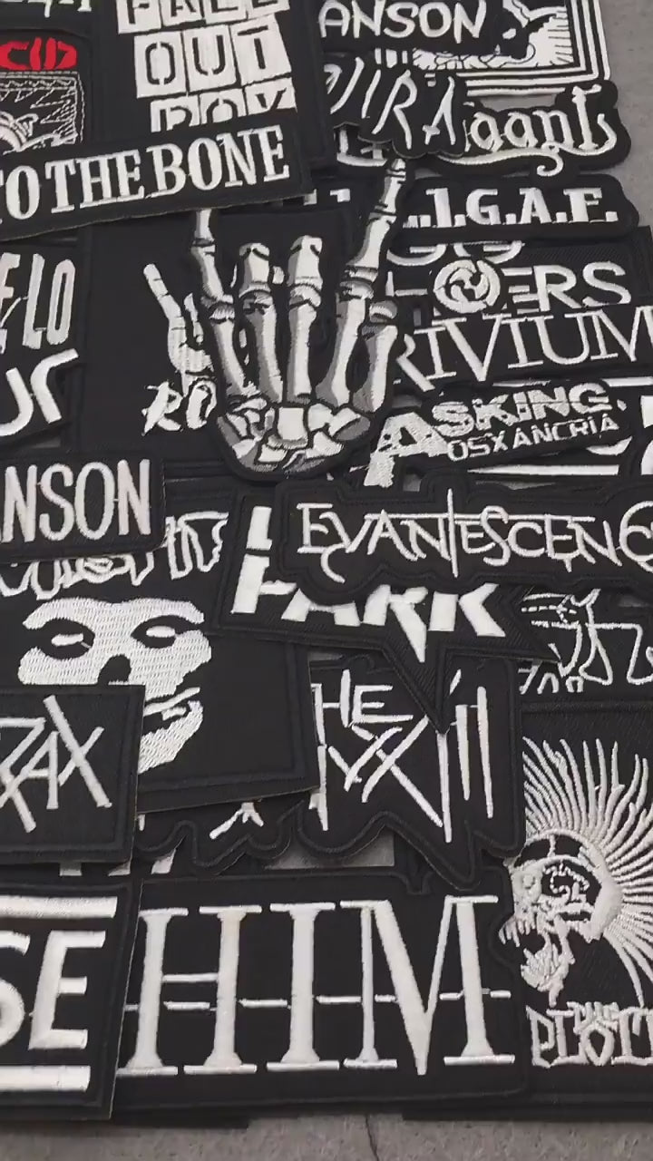 video of a Collection of music band stickers on a gray background