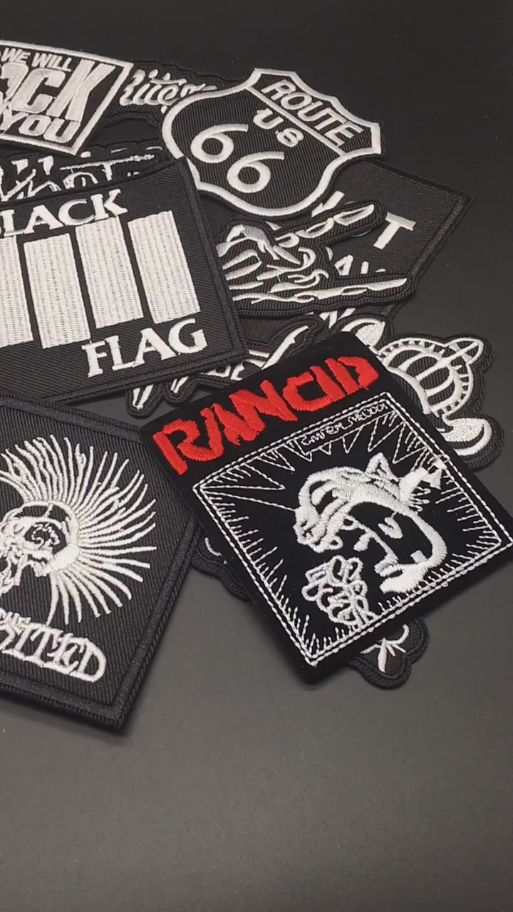 Video of a Collection of music band patches on a dark background