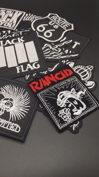 Video of a Collection of music band patches on a dark background