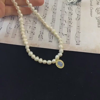 video showing irregular pearl silver necklace