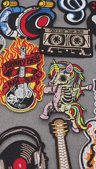 video of a collection of Rock music embroidered iron-on patches – guitar, DJ, punk appliques for clothing and bags