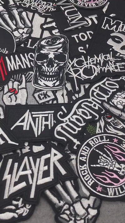 video of a Black and white embroidered band patches with logos including Marilyn Manson, Anthrax, Megadeth, Misfits