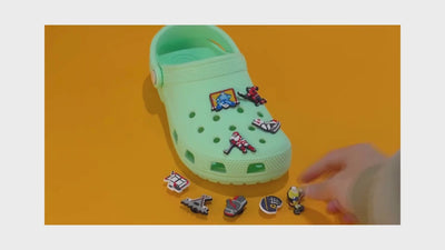video of a Collection of hockey-themed charms on a yellow 