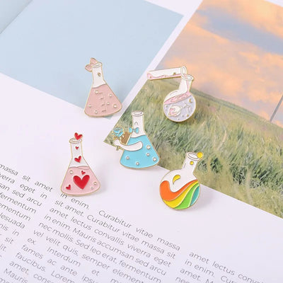 Colorful science-themed pins on a scenic background