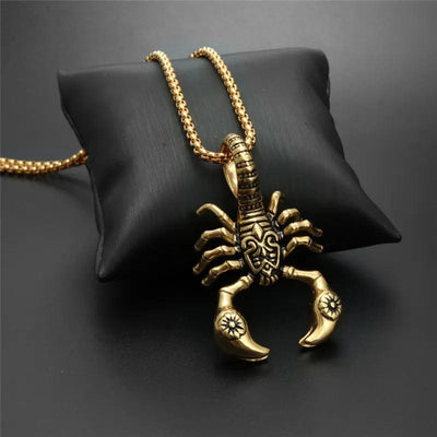 gold Scorpion Necklace on a small cushion