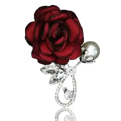 red rose with a ear and diamond look brooch