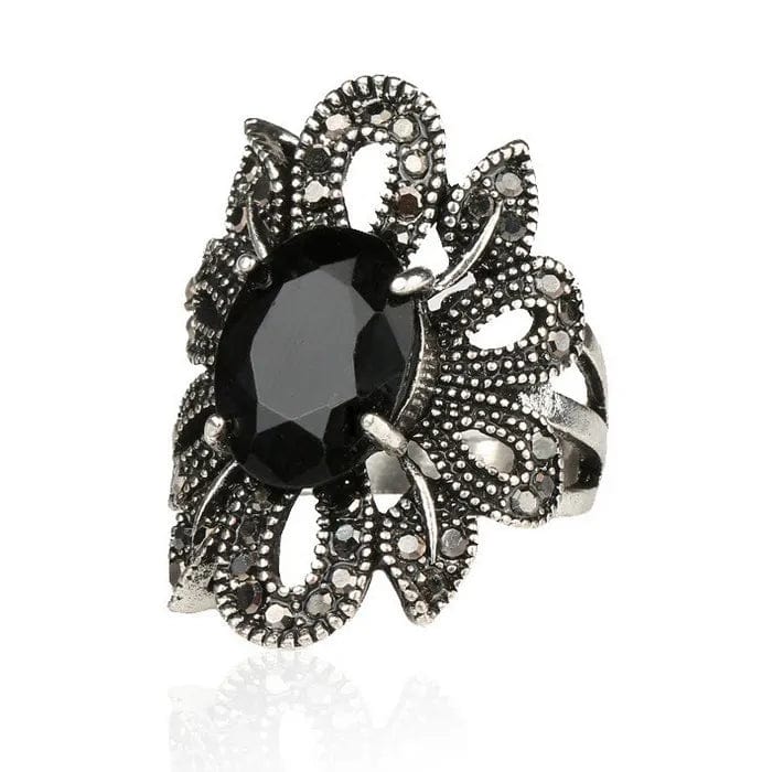 women's hollow flower black crystal ring face view.