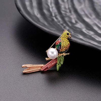natural and simple bird brooch near a black plate