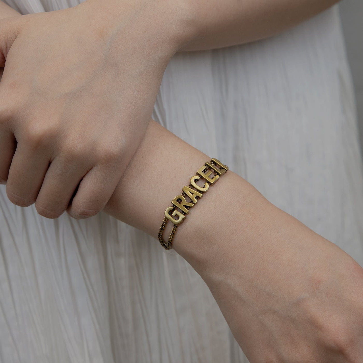 a woman wearing Personalized Name Bracelet Women