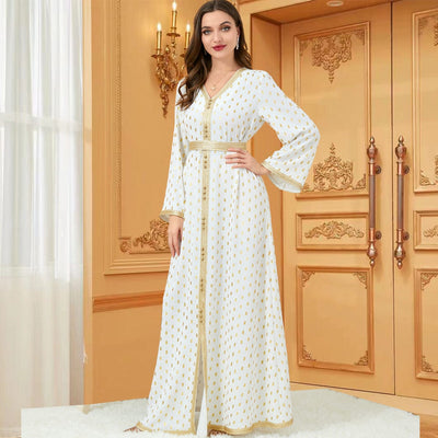 a woman wearing White long sleeve gold dress full length view