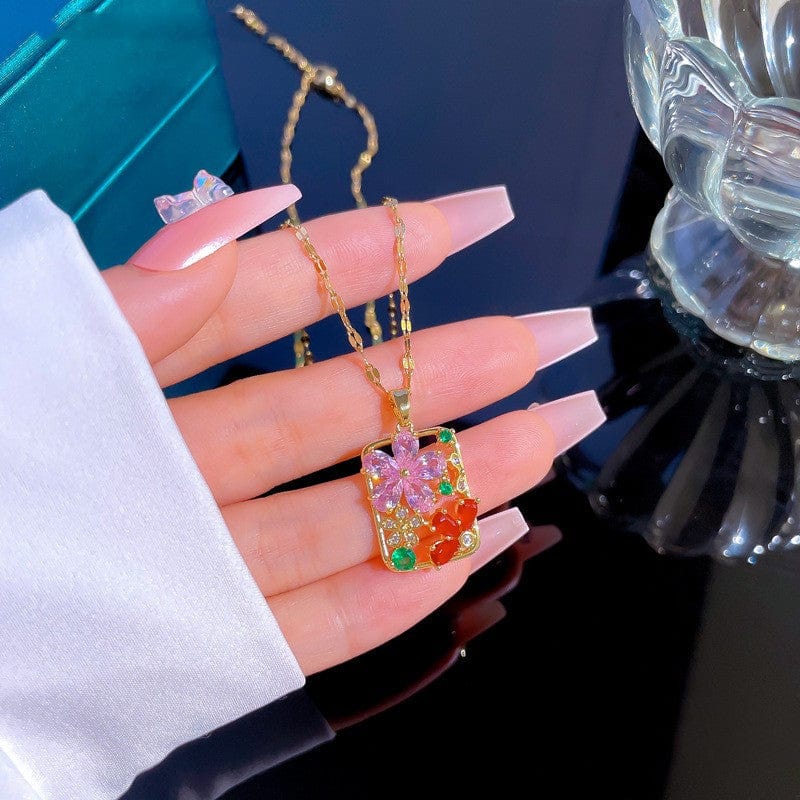 manikan hand holding titanium flower diamond necklace