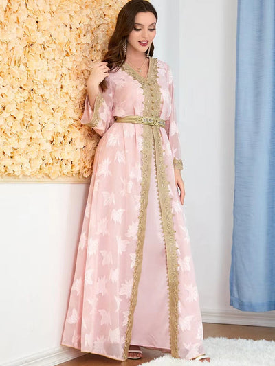 a woman wearing a pink new national style embroidered v-neck dress full length view