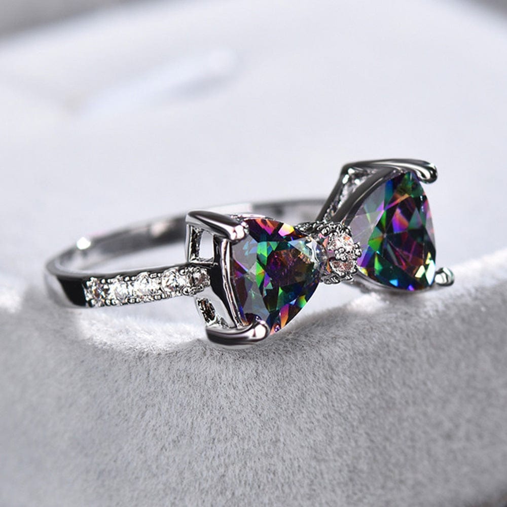 women's bow zircon ring face view on a flat surface
