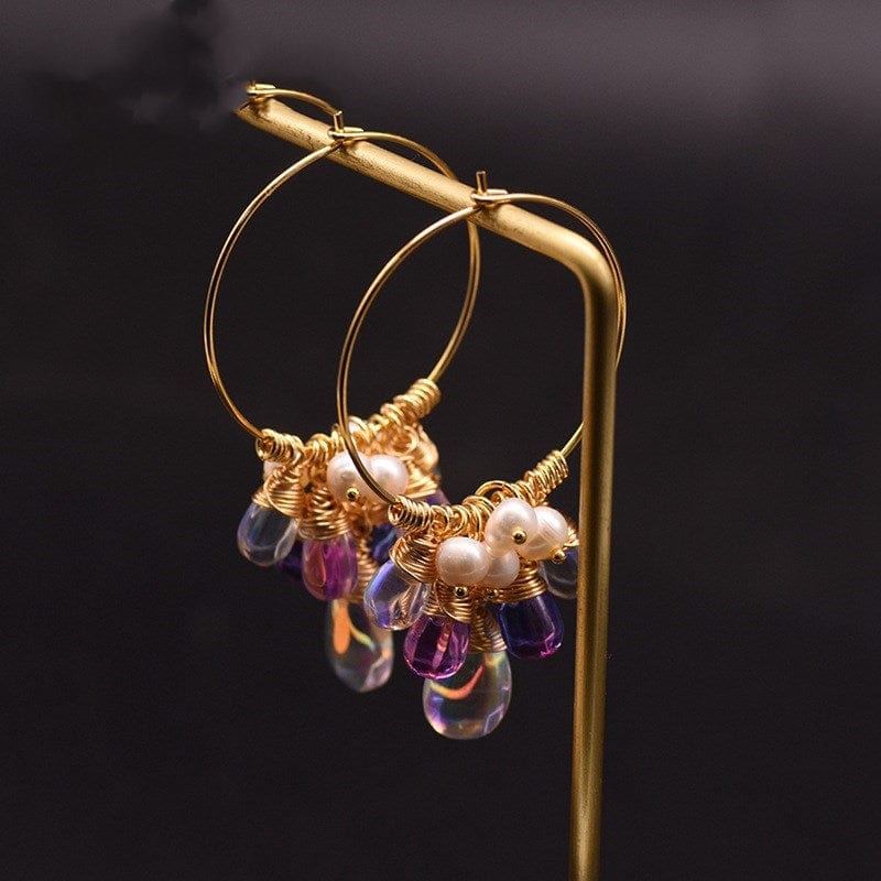 Gold Pearl Czech crystal earrings hanging on metal bar