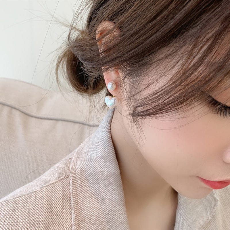 closeup of a woman wearing Simple Temperament Love Pearl Stud Earrings 