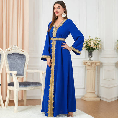 a woman wearing Blue solid color embroidery long-sleeved dress full length view